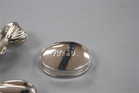 Three assorted modern silver pill boxes, including one modelled as a sweet and one engraved Viagra,